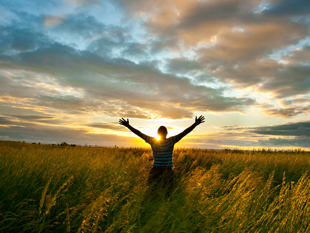 sun beind the man